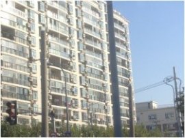 a big, high-rise apartment building is shown, making use of many mini-split methods – one or more per apartment.